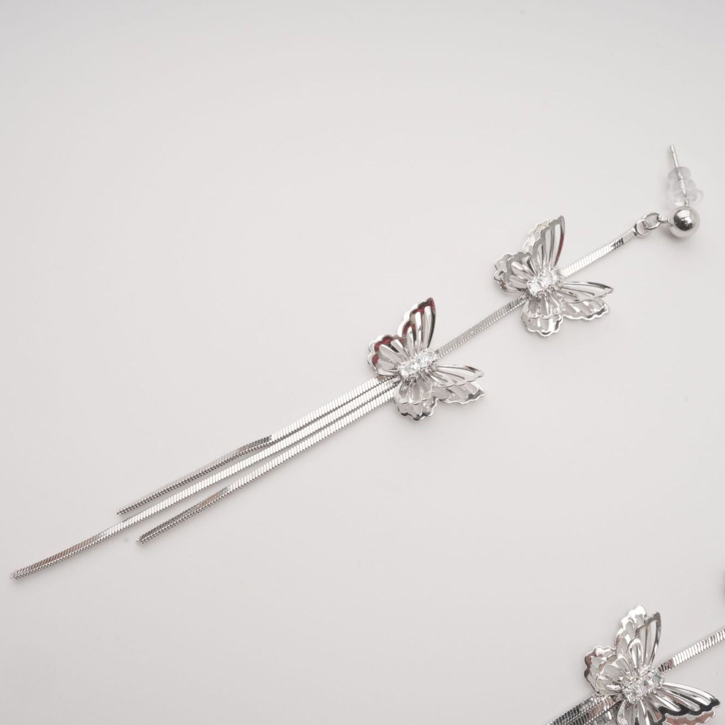 Bella silver butterfly drop earrings